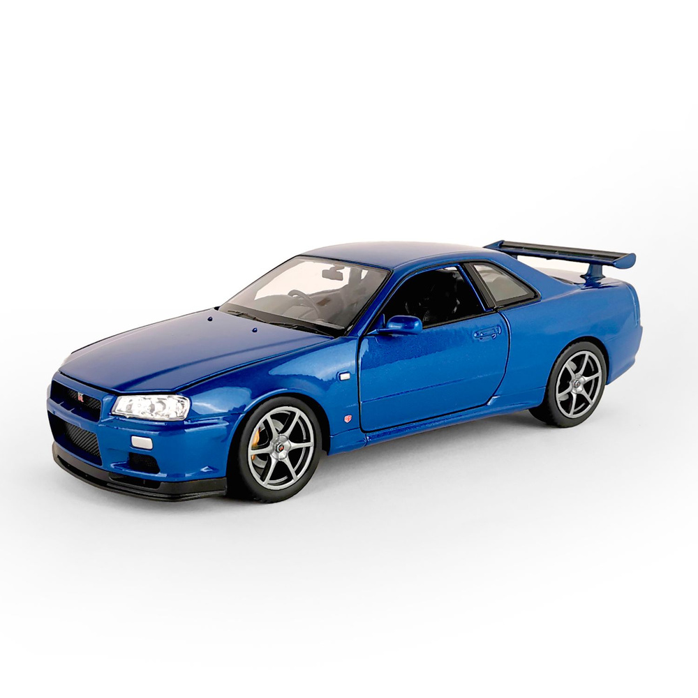 Машинка WELLY 1:24 Nissan Skyline GT-R R34 синий - купить с доставкой по  выгодным ценам в интернет-магазине OZON (1387471738)