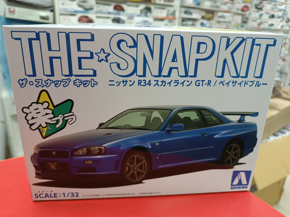 Сборная модель Aoshima 1:32 06250 Nissan Skyline GT-R R34 (Bayside Blue) сборка без клея  #1