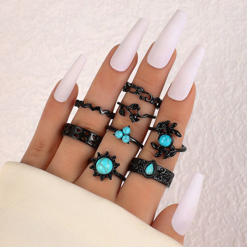 Комплект из 8 черных колец с бирюзовыми камнями \"Листочки и капля ...