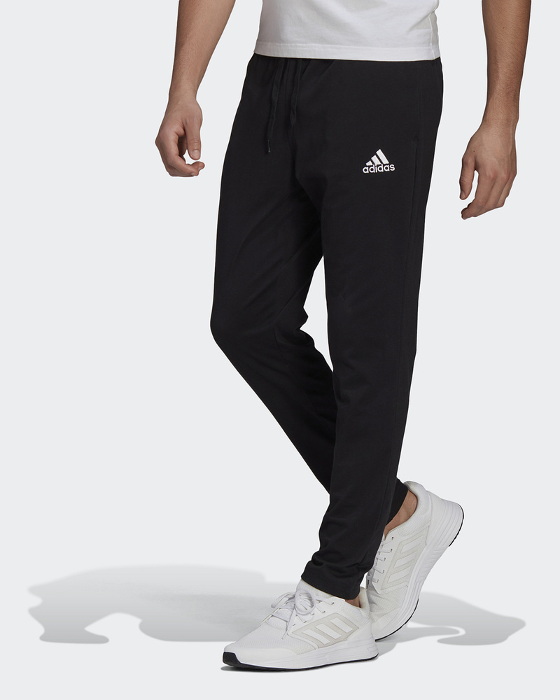 Брюки спортивные adidas Sportswear Essentials Tapered Joggers #1