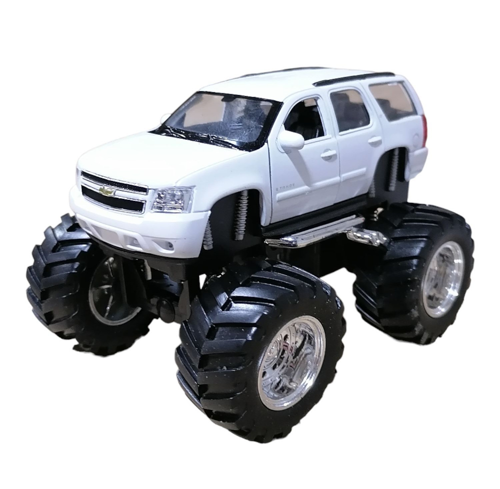 Игрушка модель машины 1:34-39 Chevrolet Tahoe Big Wheel 47002 Welly -  купить с доставкой по выгодным ценам в интернет-магазине OZON (951817341)