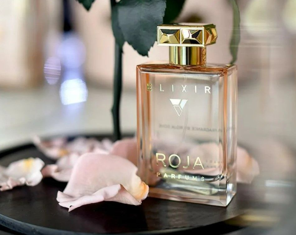 Roja elixir essence. Roja Elixir Парфюм. Roja Parfums эликсир. Духи Roja dove Elixir. Раджа эликсир Парфюм.