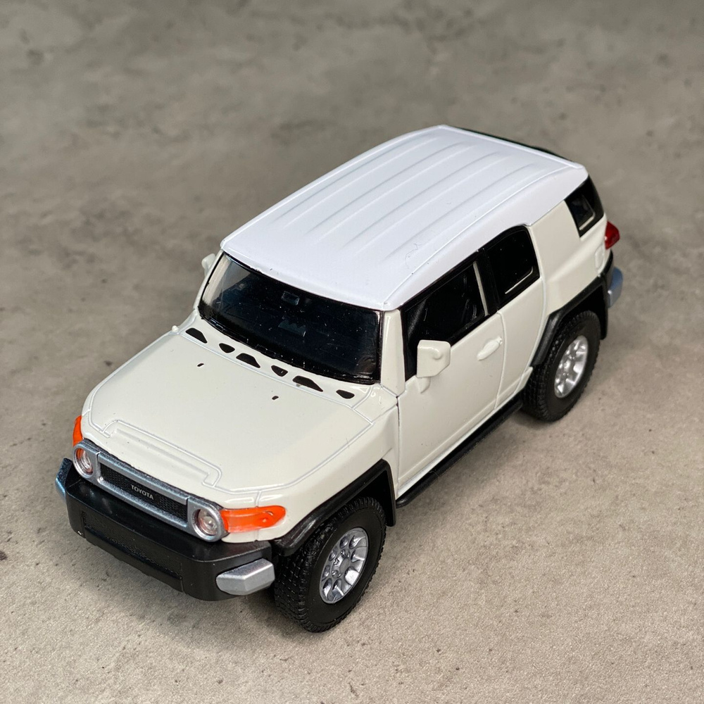 Металлическая машинка Welly TOYOTA FJ CRUISER Тойота Крузер, инерционная,  цвет Белый - купить с доставкой по выгодным ценам в интернет-магазине OZON  (978231358)