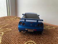 Модель автомобиля Nissan Skyline GT-R R34 инерционная машинка 1:28 синяя длина 14.5см, со светом и звуком #53, Ляйсан М.